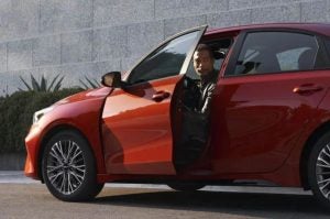 Open Door of Red 2022 Kia Forte