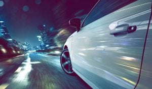 Car Driving in City at Night
