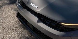 Kia Badge On the Front of a New Kia Temple Hills, MD