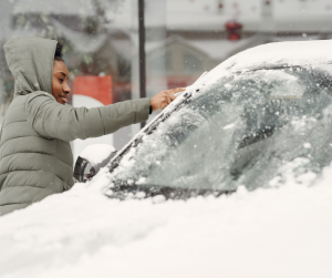 Woman beside snow covered car | Frederick, MD