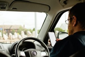 Close up Using Phone while Driving | Frederick, MD