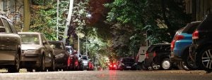 Cars parked on the street at night | Frederick, MD