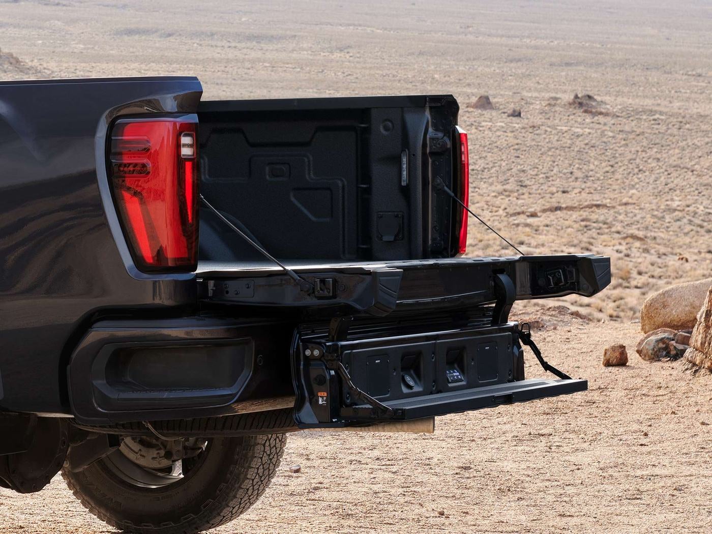Open MultiPro tailgate on a GMC Sierra HD heavy duty pickup in the desert