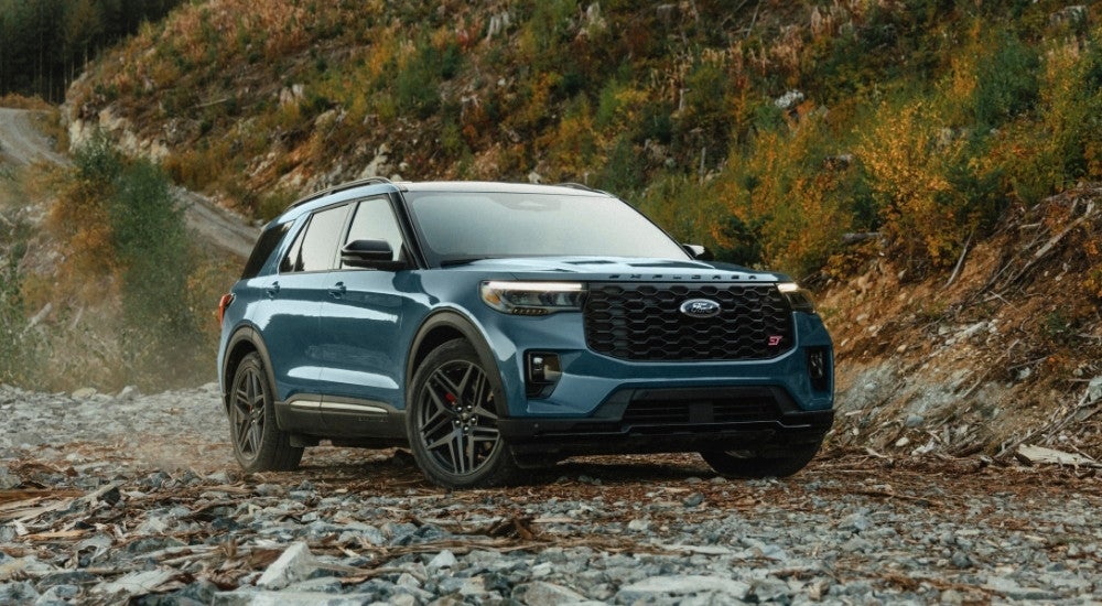 A blue 2024 Ford Explorer from the front at an angle.