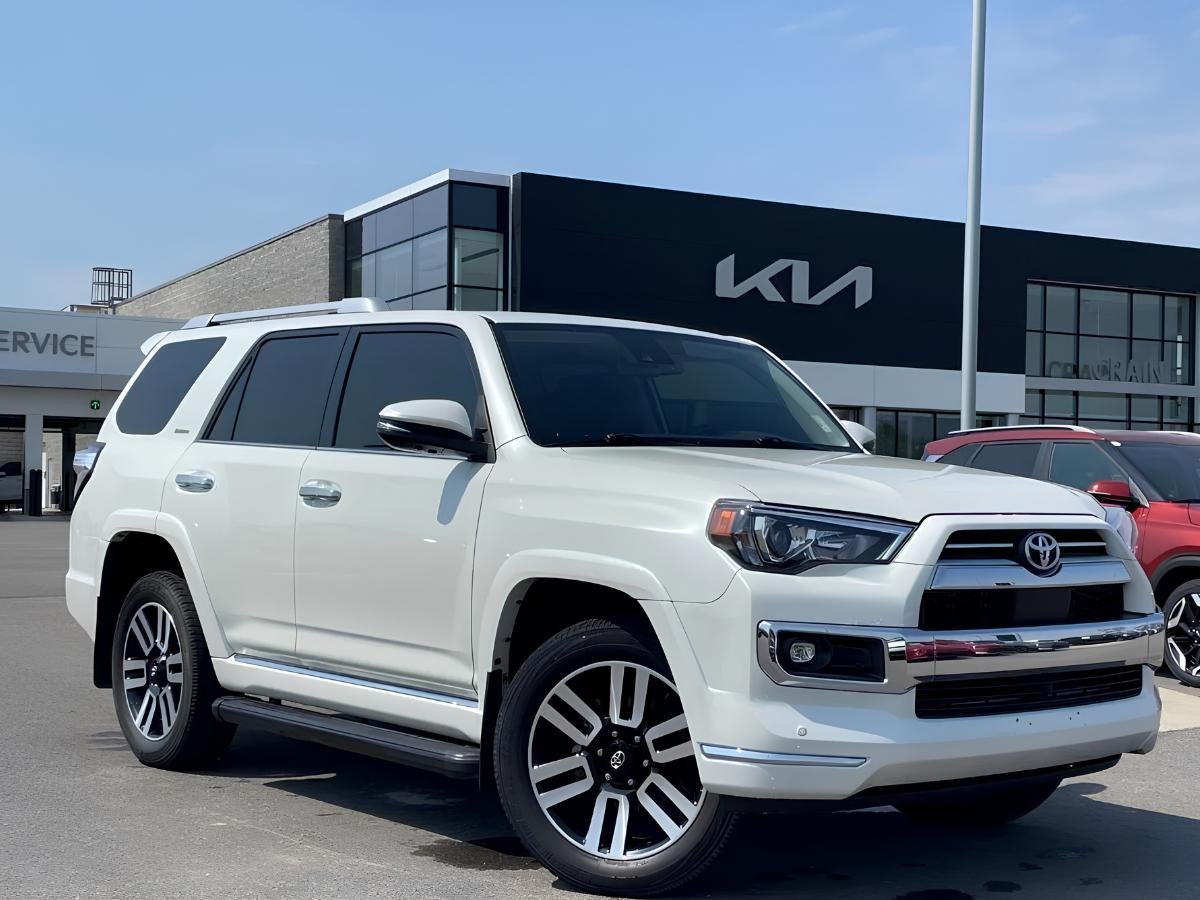 White Toyota 4Runner parked in front of Crain Kia of Fort Smith dealership