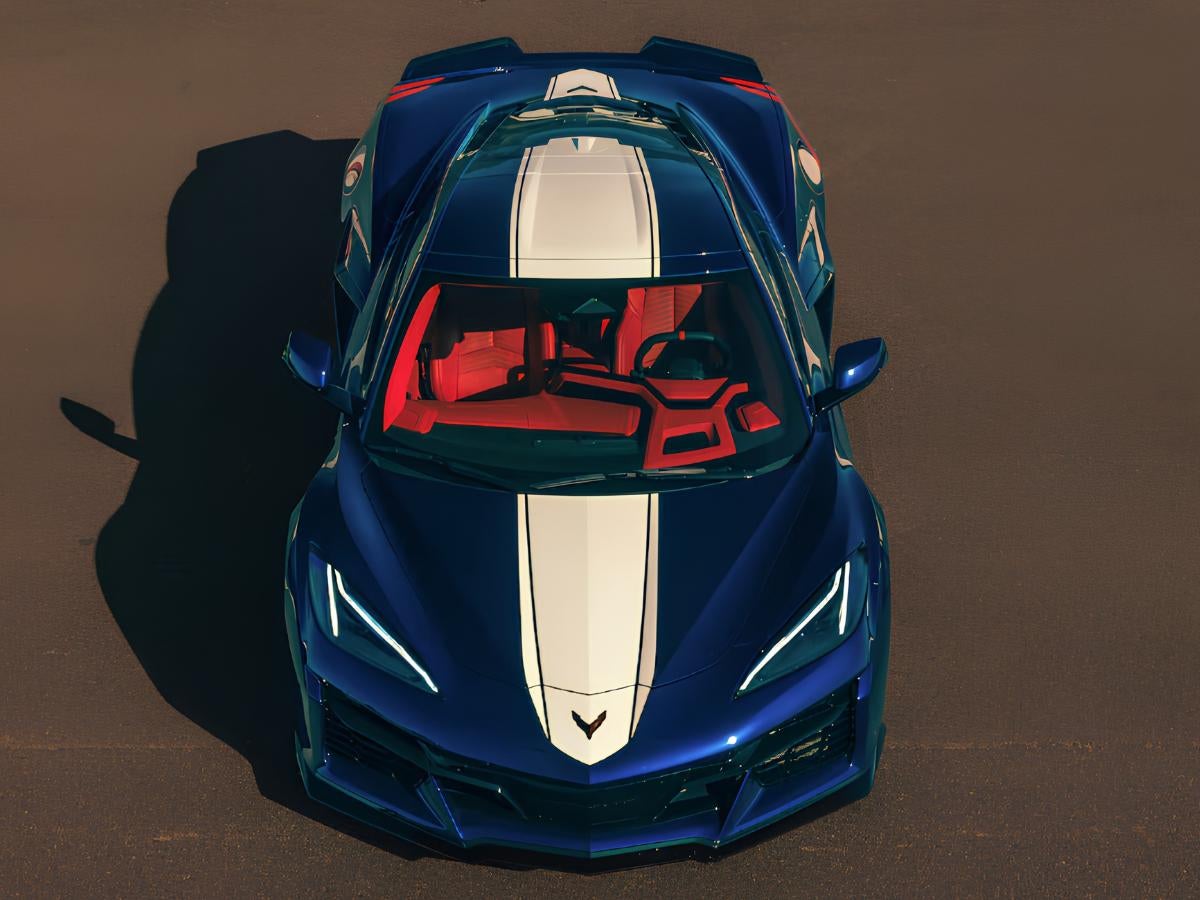 2027 Chevy Corvette Grand Sport blue exterior with white racing stripe and red interior top view