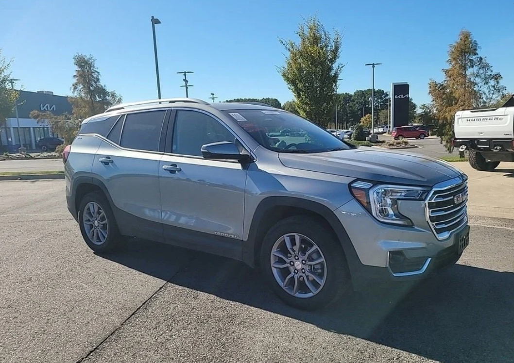 Silver 2023 GMC Terrain SLE parked outside Crain Buick GMC in Conway, Arkansas