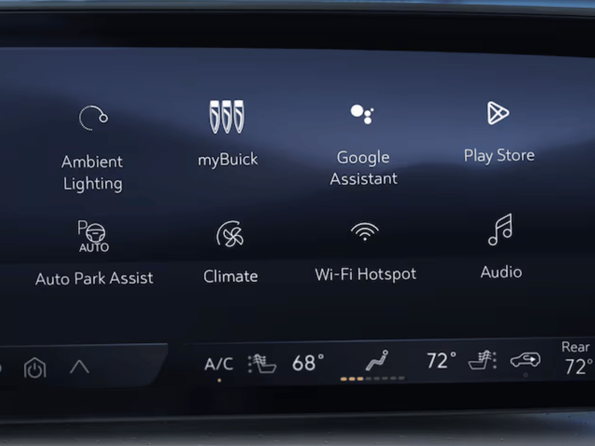 Touchscreen display in the 2025 Buick Envision featuring Google Assistant, Play Store, myBuick, Auto Park Assist, and climate controls