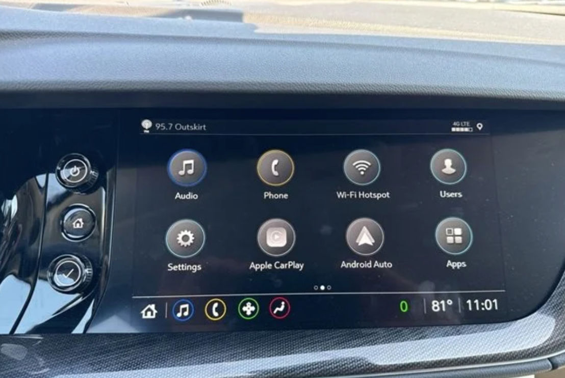 Touchscreen display in a Buick GMC vehicle showing access to OnStar services, audio, phone, Wi-Fi hotspot, and smartphone integration