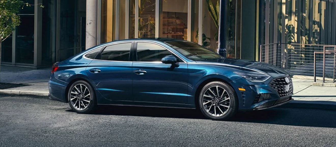 Blue Hyundai sedan parked outside a modern building in North Little Rock.