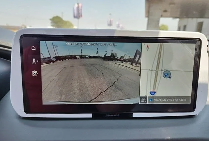 Hyundai vehicle infotainment screen showing rearview camera and navigation map