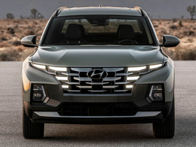 Front view of a parked 2023 Hyundai Santa Cruz with the headlights on. | Hyundai dealer in Fort Smith, AR | Crain Hyundai of fort Smith