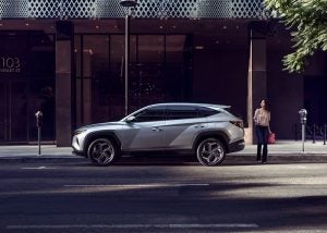 Profile view of a parked, silver 2022 Hyundai Tucson. | Hyundai dealer in Fort Smith, AR.