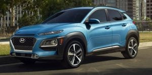 A parked, light blue 2021 Hyundai Kona. | Hyundai service center in Fort Smith, AR.