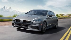 Front view of a gray 2022 Hyundai Sonata being driven on the highway. | Hyundai dealer in Fort Smith, AR.