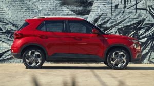 Profile view of a red 2021 Hyundai Venue. | Hyundai dealer in Fort Smith, AR.