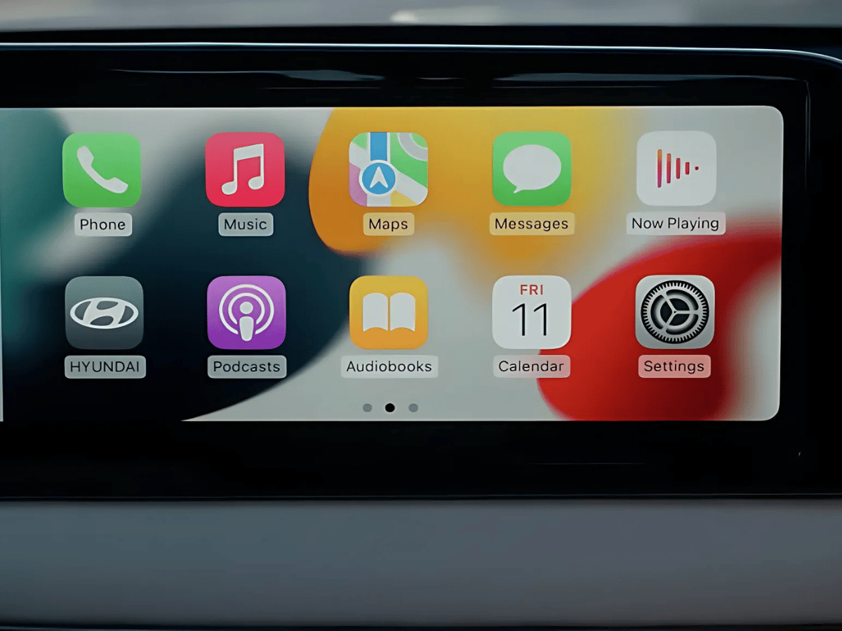 Close-up of the 2025 Hyundai Kona infotainment screen displaying Apple CarPlay with apps like Maps, Music, and Messages.