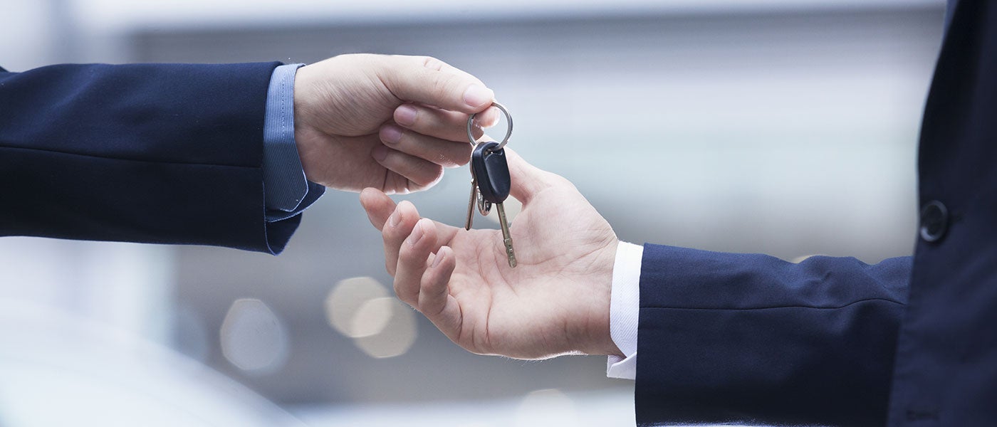 Ford Salesman handing over car keys