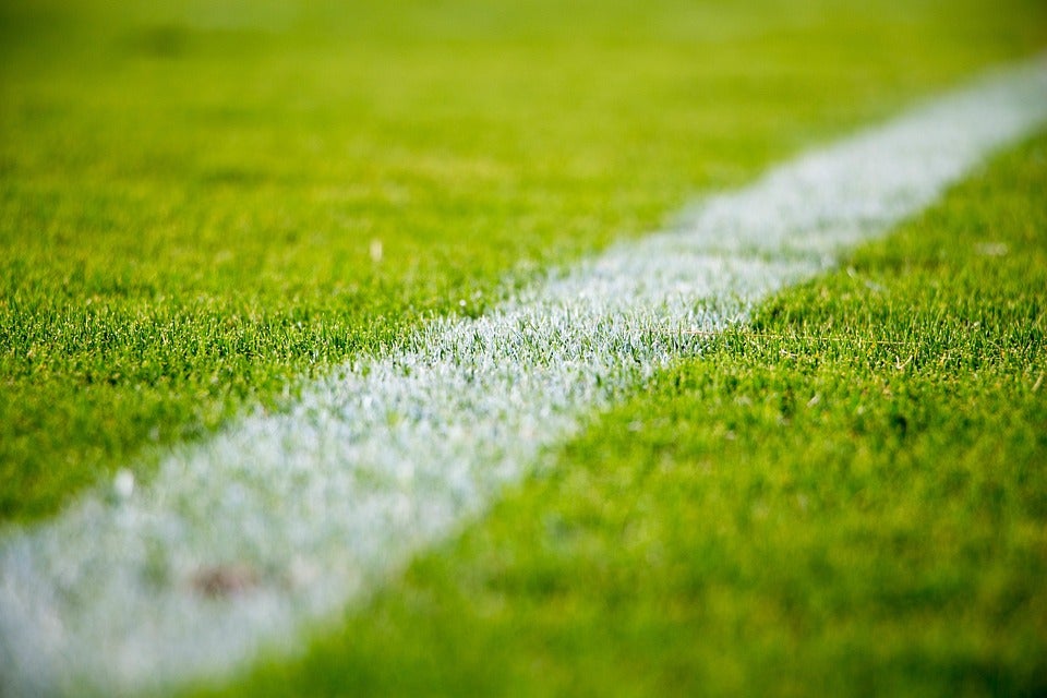 Close view of one of the lines on a football field. | Stadiums around Jacksonville, AR.