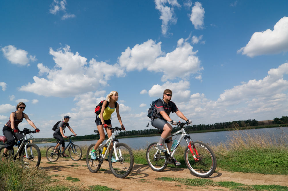 A group of feeling riding bikes on a trail. | Bike trails in Jacksonville, AR.