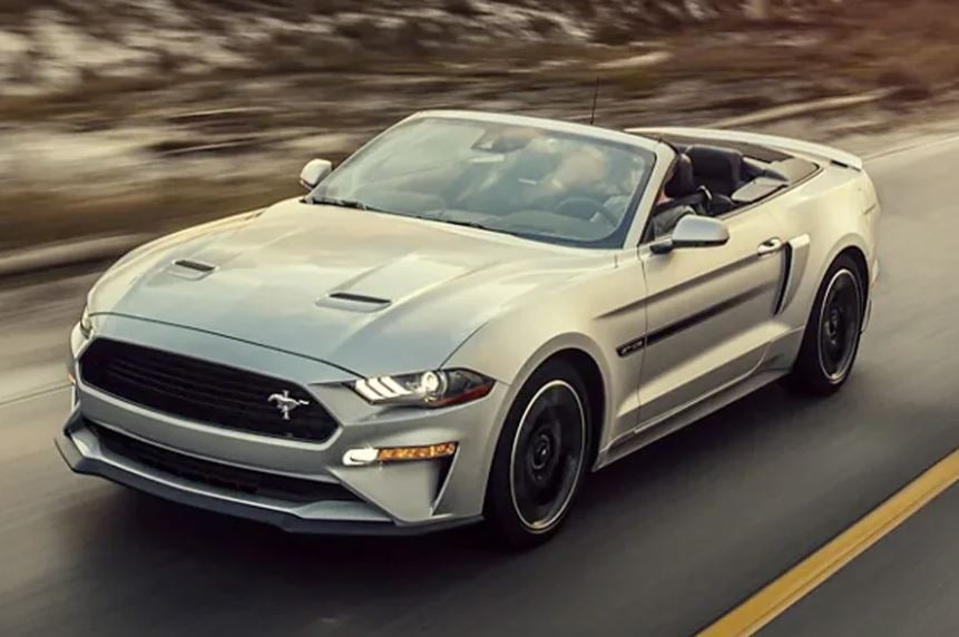Silver 2022 Ford Mustang being driven on the highway. | Ford service center in Jacksonville, AR.