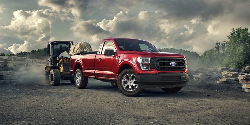 Red 2021 Ford F-150 at a construction job site. | Ford dealer in Jacksonville, AR.