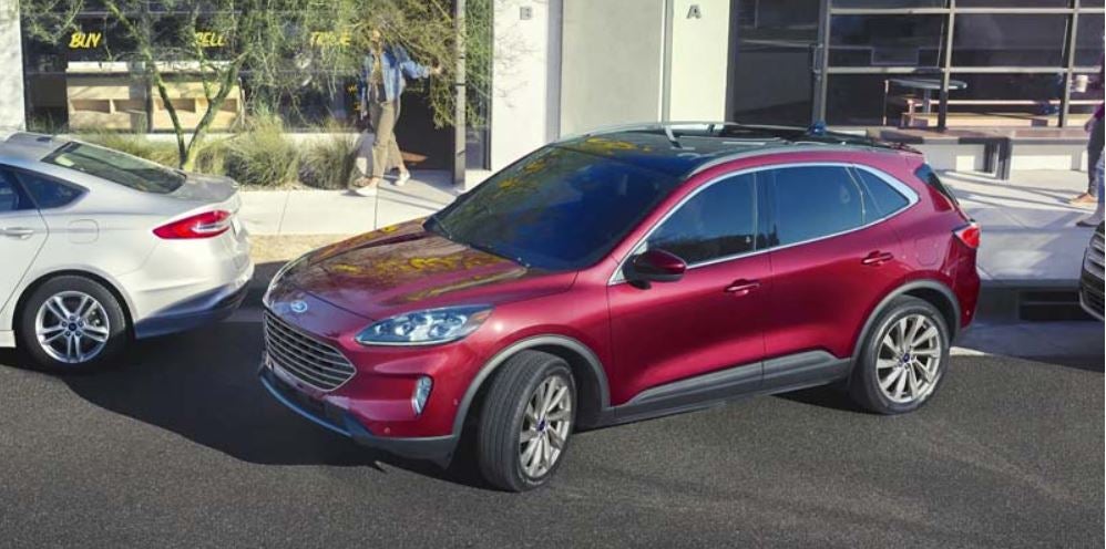 A dark red 2022 Ford Escape being parallel parked. | Ford dealer in Little Rock, AR.