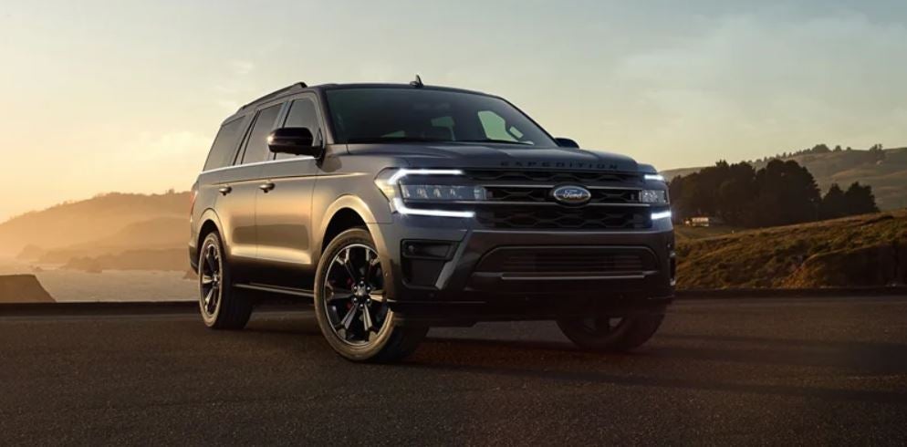 Front view of a gray 2022 Ford expedition parked with trees in the background. | Ford service center in Little Rock, AR.