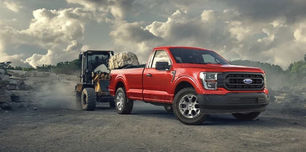Red 2023 Ford F-150 parked in a work area. | Ford dealer in Little Rock, AR.