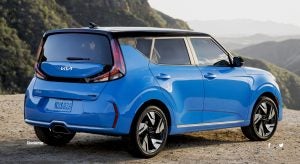 Rear profile view of a parked, light blue 2023 Kia Soul. | Kia dealer in Sherwood, AR.