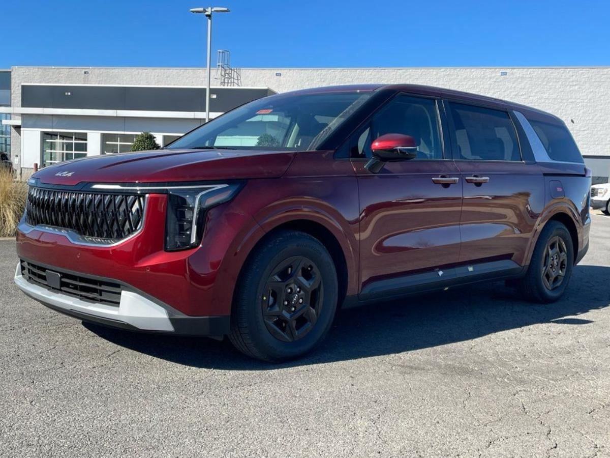 Kia Carnival in Conway AR parked at Crain Kia of Conway dealership showing spacious family minivan design