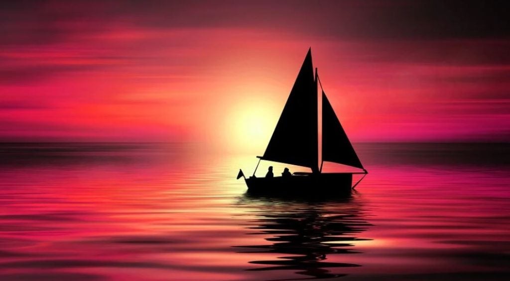 A sailing boat on the water at sunset. | Boating near Conway, AR | Crain Kia of Conway