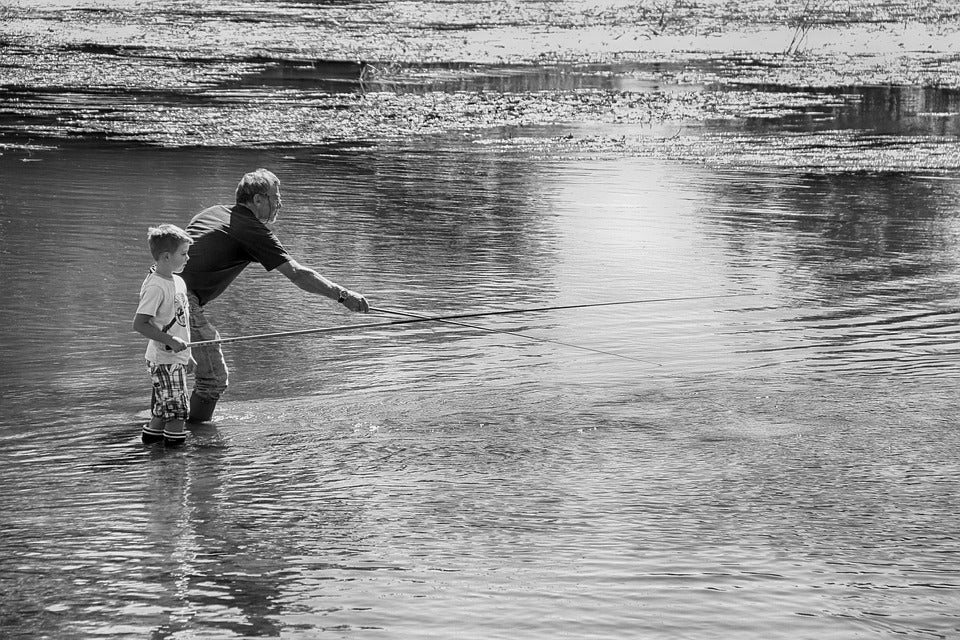A father and son fishing. | Fun activities around Conway, AR.