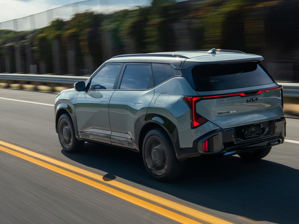 Gray 2027 Kia Seltos driving on a highway