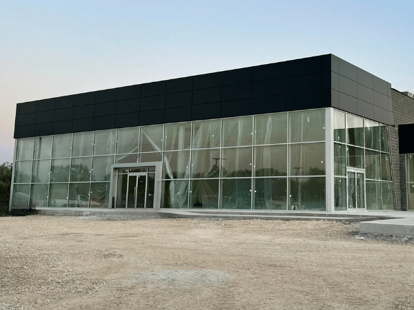 Outside the new Crain Kia of Bentonville Building