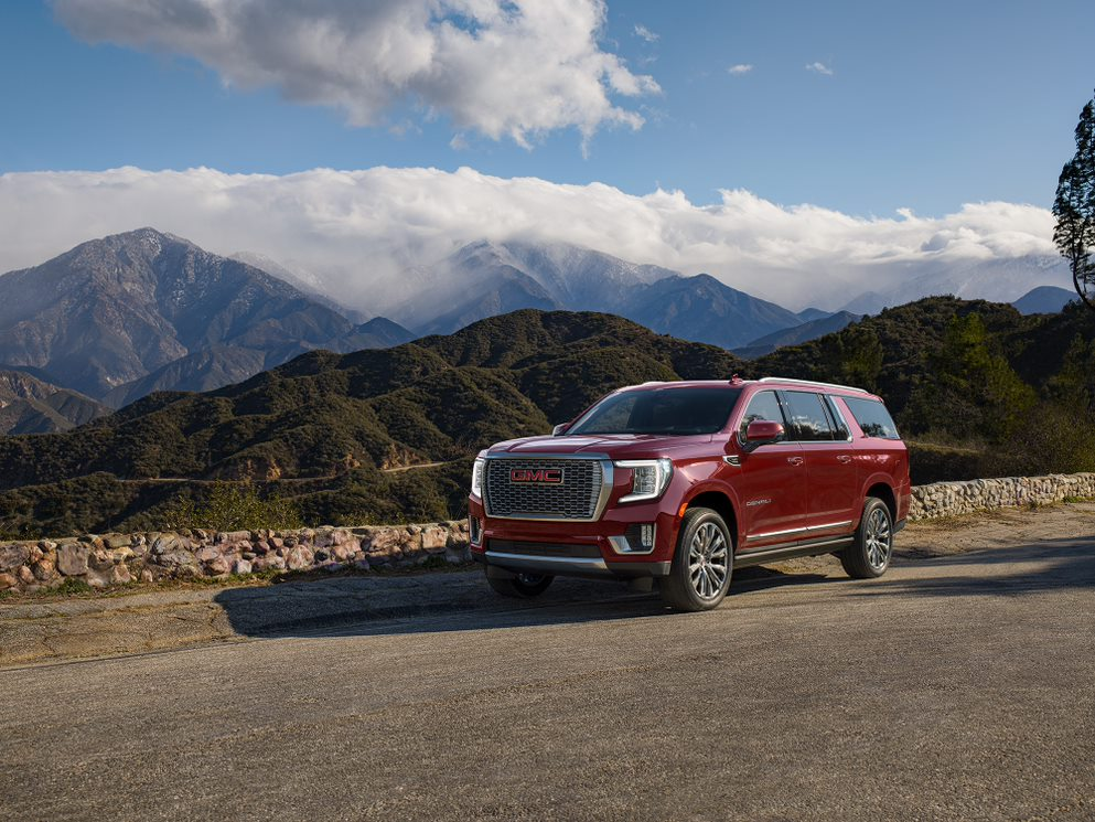 GMC Yukon XL in front of mountains