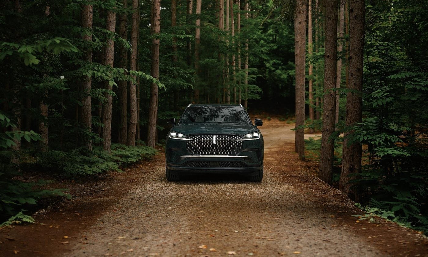 2027 Lincoln Aviator on a wooded road near Sunset Hills MO