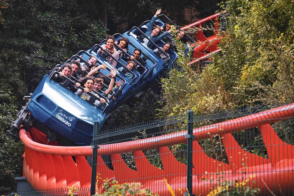 Bennett Hyundai of Lebanon is a Hyundai Dealership in Lebanon near Hershey, PA | People Riding on Blue Roller Coaster on Red Track through Trees