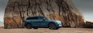2025 Lincoln Corsair exterior parked in front of luxury dealership entrance.