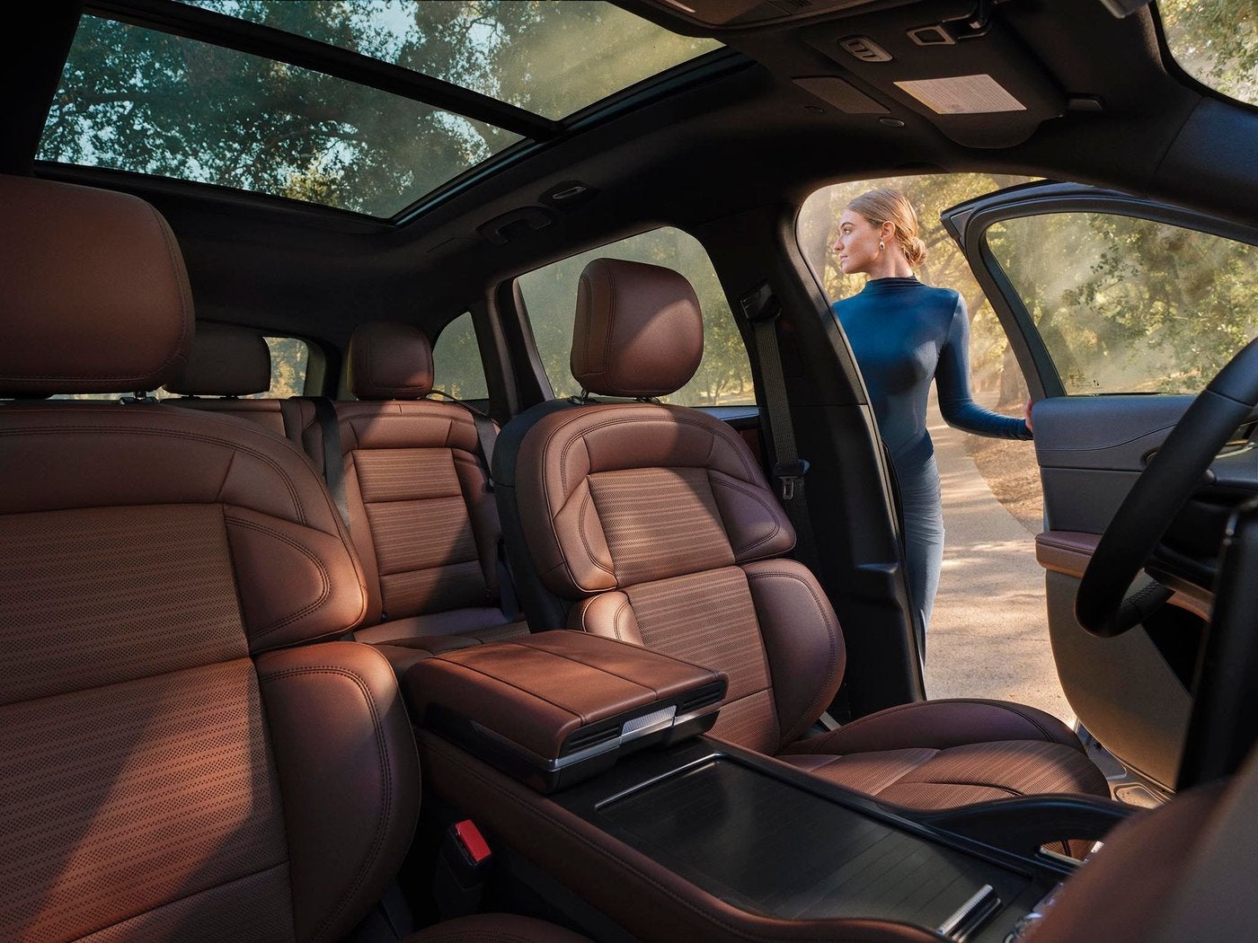 Lincoln Nautilus front seats in brown leather with the driver door open