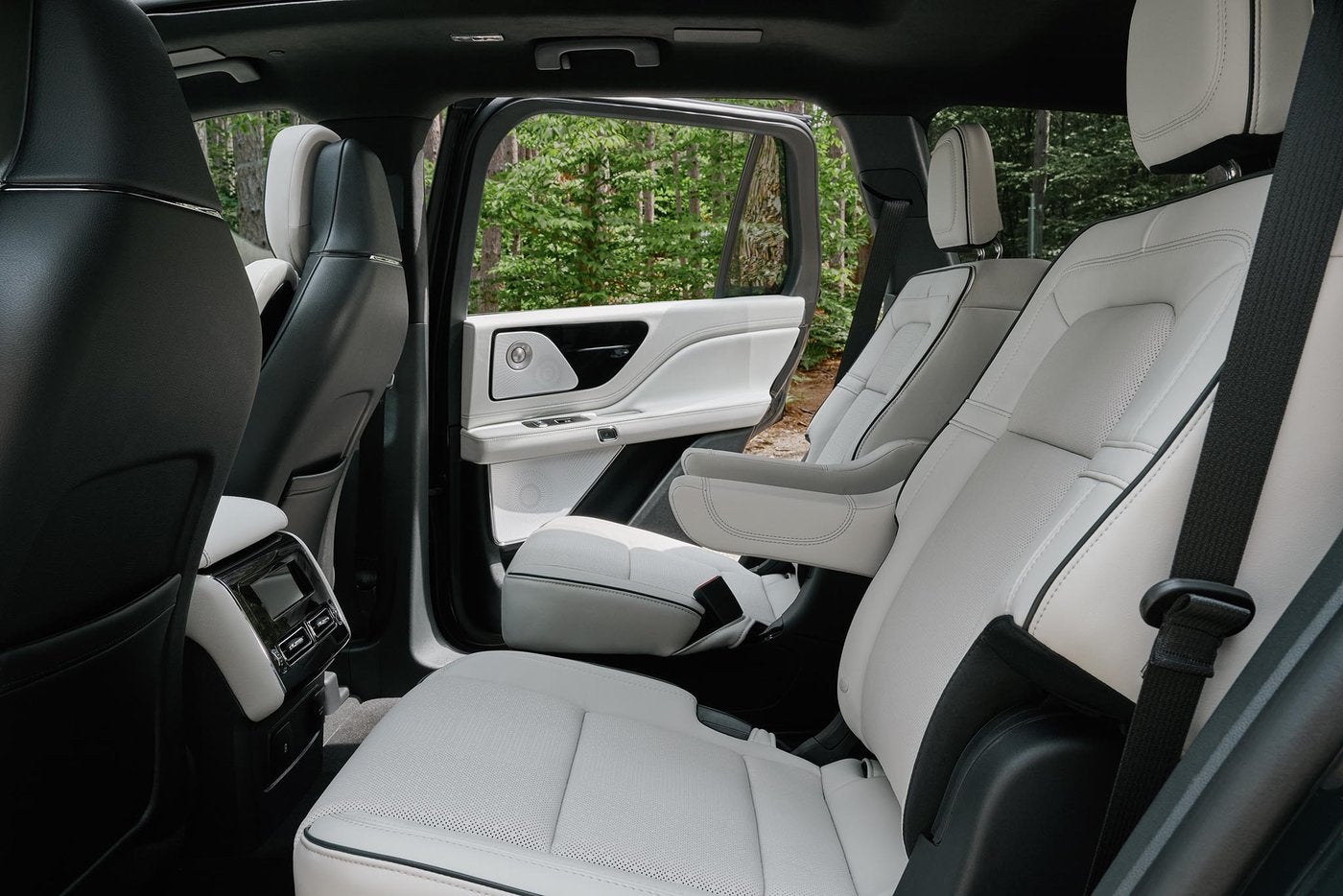Lincoln Aviator Black Label second row in white leather seen through the open door