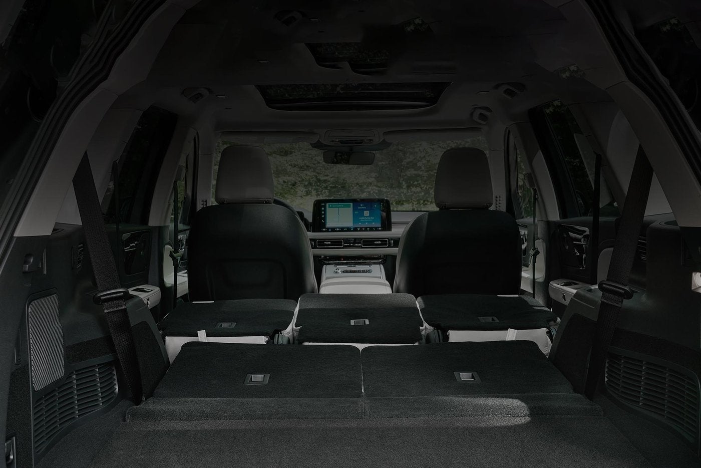 Lincoln Aviator cargo area with the rear seats folded flat seen through the liftgate