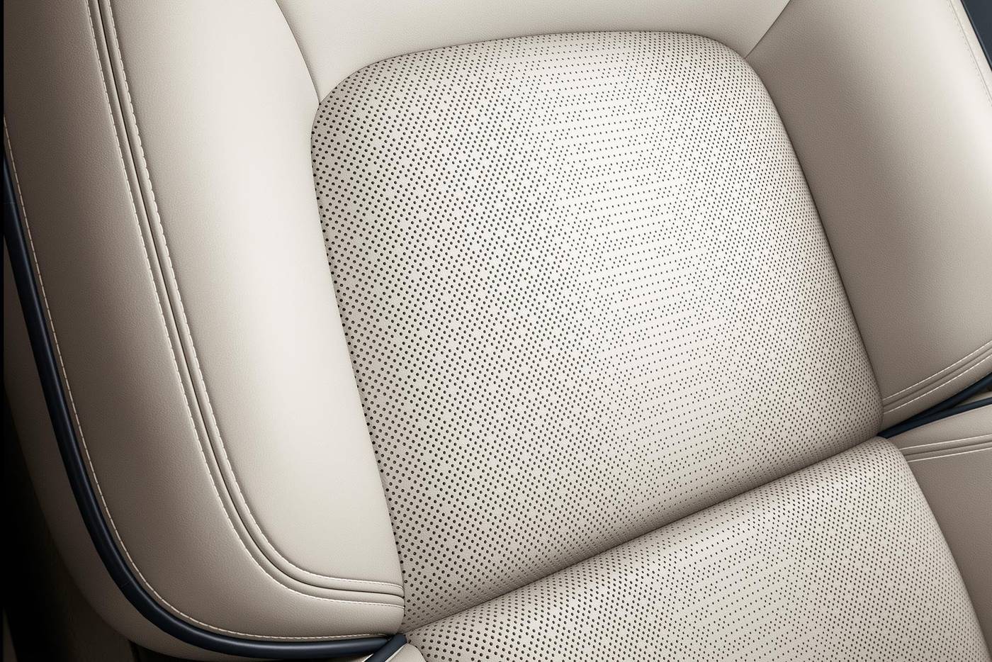 Close view of the clean perforated leather seat inside a Lincoln Aviator
