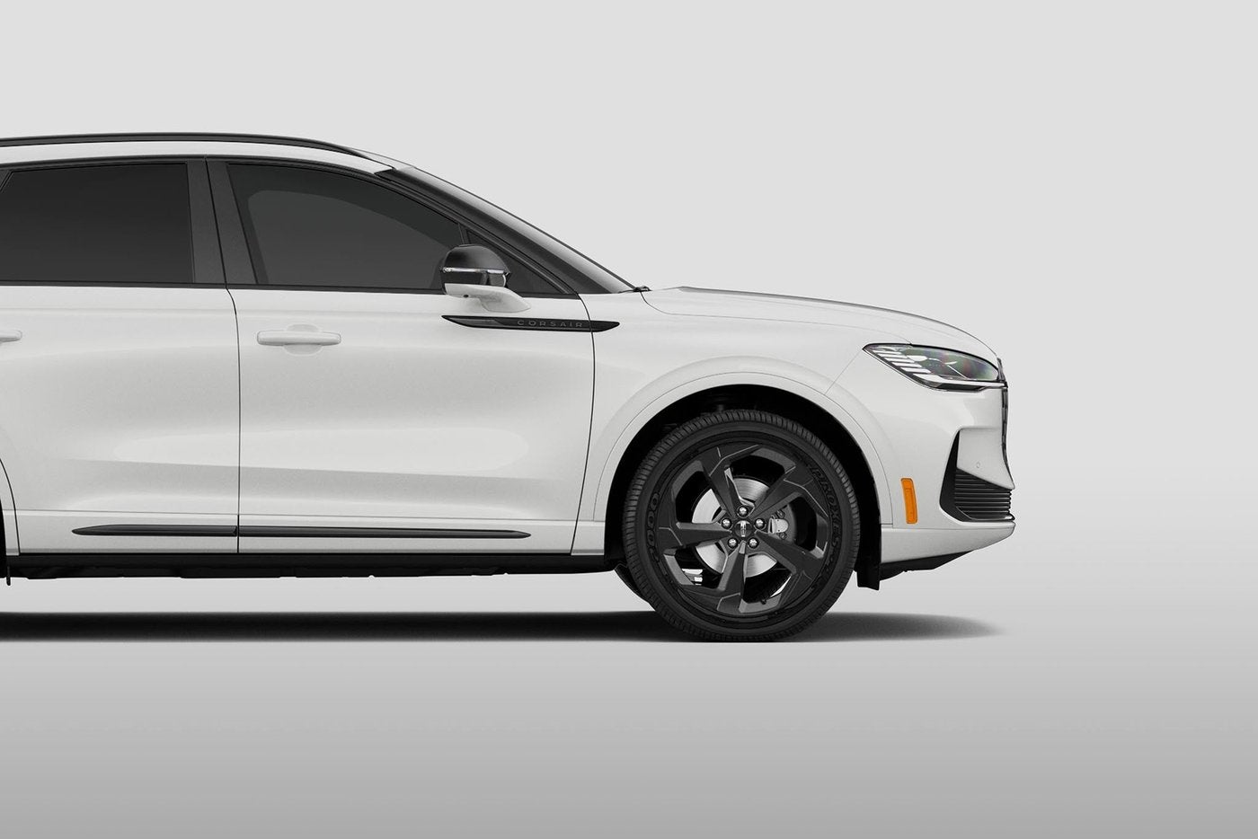 White Lincoln Corsair side profile showing the black wheel and tire