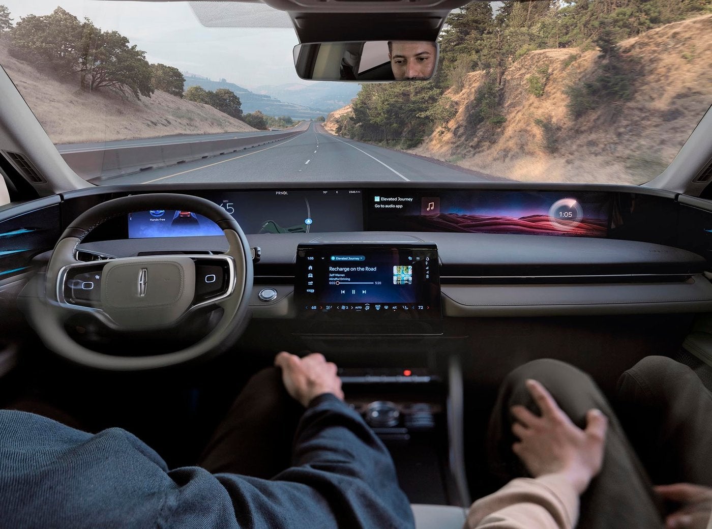 Lincoln Nautilus cockpit on the highway with the driver using hands free assist
