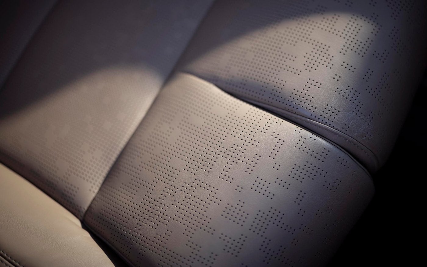 Close view of the perforated pattern on a Lincoln Navigator Black Label seat
