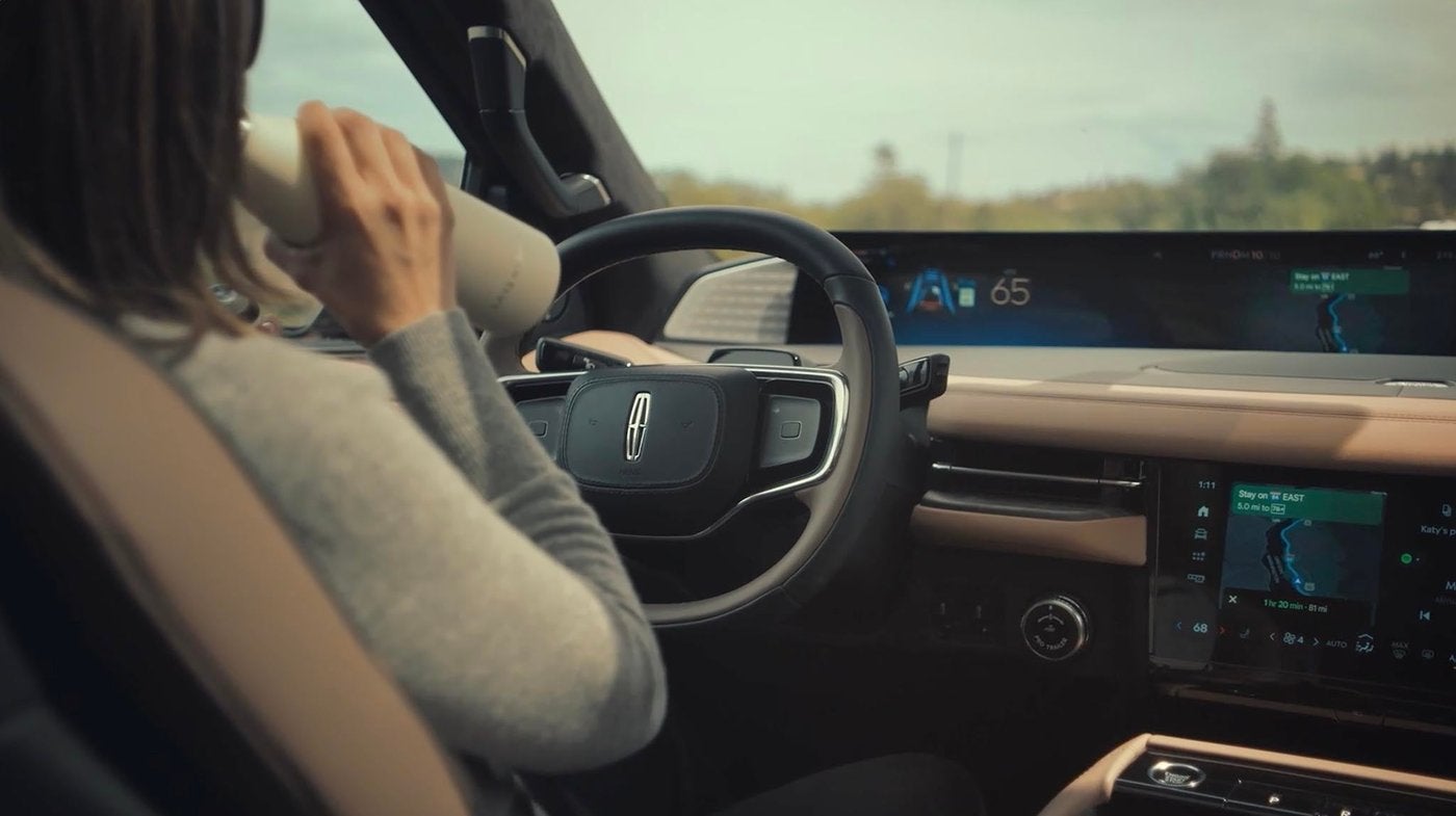 Driver using highway driving assist in a Lincoln Navigator near St. Charles MO