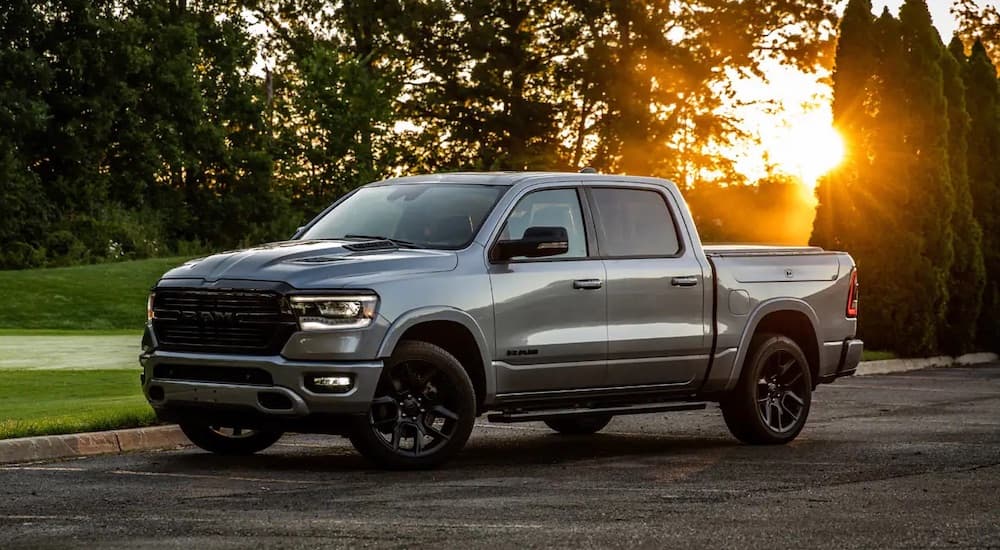 A grey 2022 Ram 1500 is shown from the side after leaving a used Ram dealer.