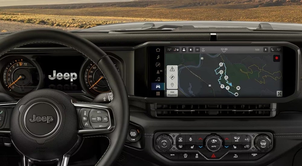 Directions on the infotainment screen in a 2025 Jeep Wrangler for sale.