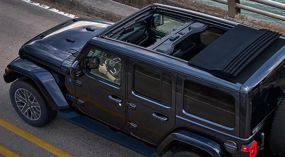 A grey 2024 Jeep Wrangler High Altitude is shown from the side at a high angle.